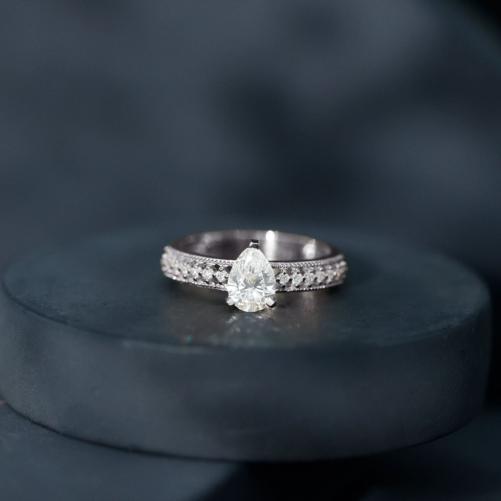 Pear Shaped Moissanite Solitaire Engagement Ring with Beaded Design