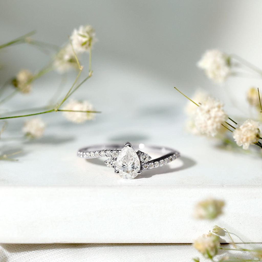 Pear Cut Moissanite Bypass Engagement Ring with Side Stones