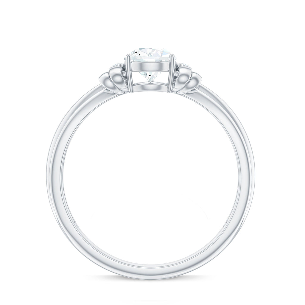 0.7 Carat Pear Shape Moissanite Bow Engagement Ring