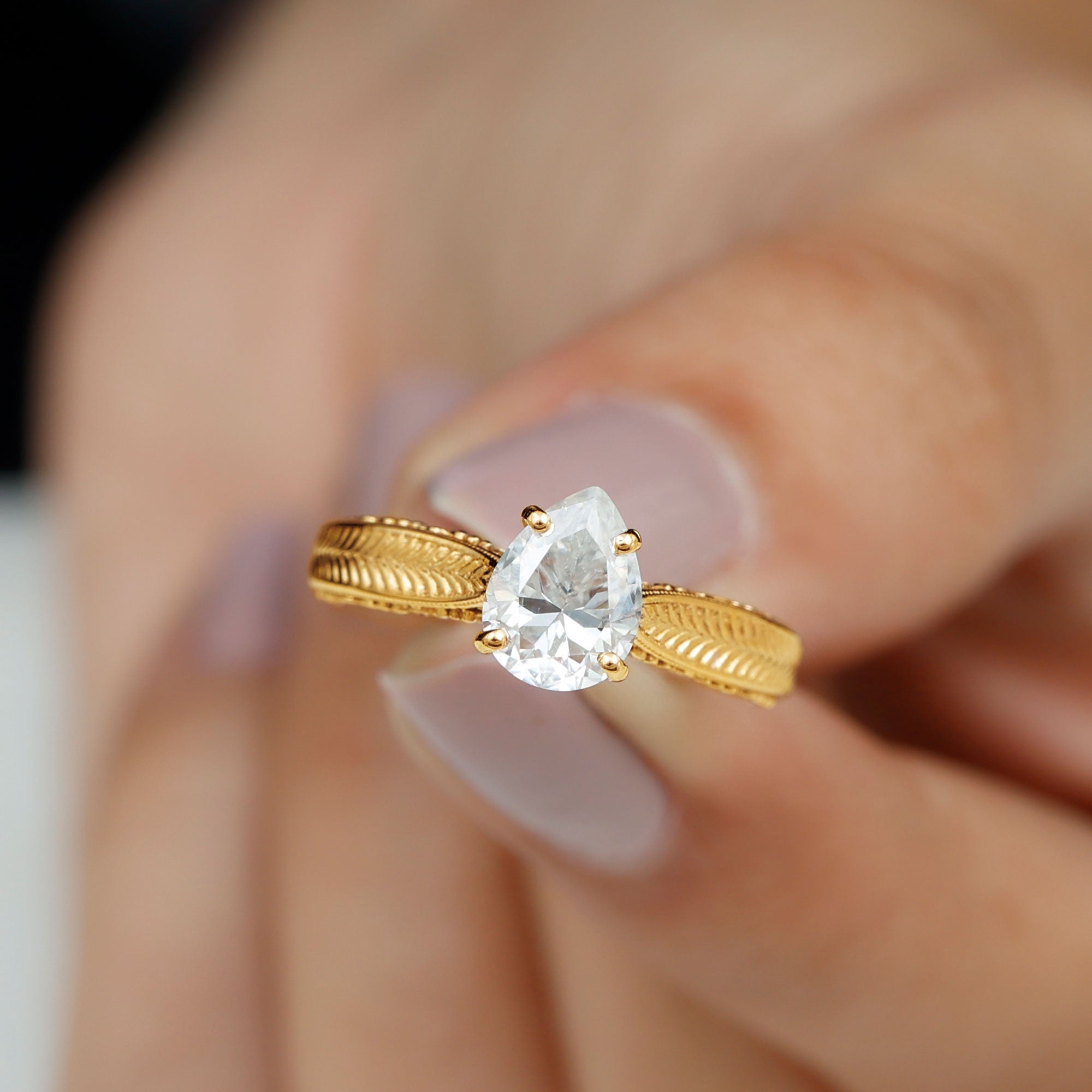 Claw Set Pear Shape Moissanite Engagement Ring