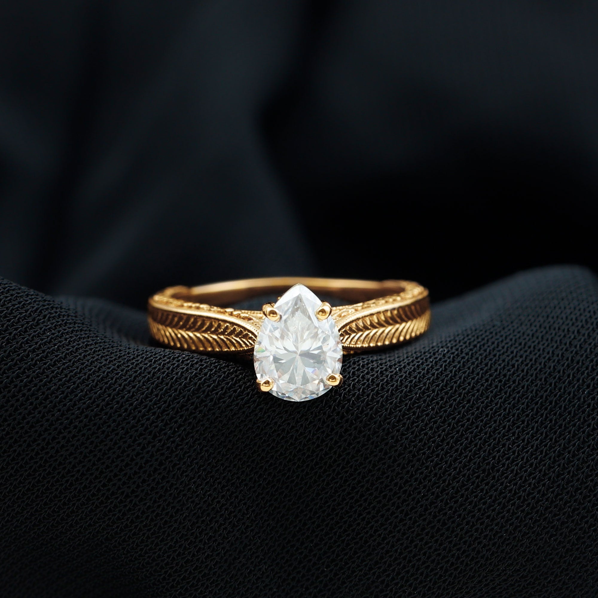 Claw Set Pear Shape Moissanite Engagement Ring
