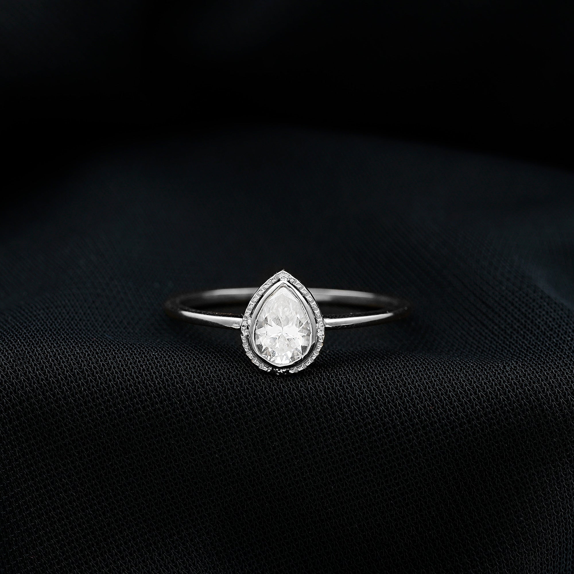 Pear Shaped Moissanite Solitaire Engagement Ring in Bezel Setting