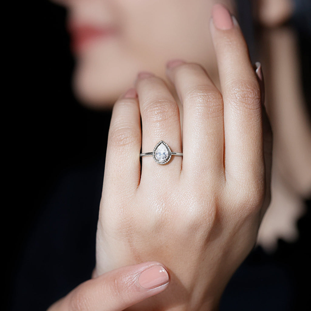 Pear Shaped Moissanite Solitaire Engagement Ring in Bezel Setting