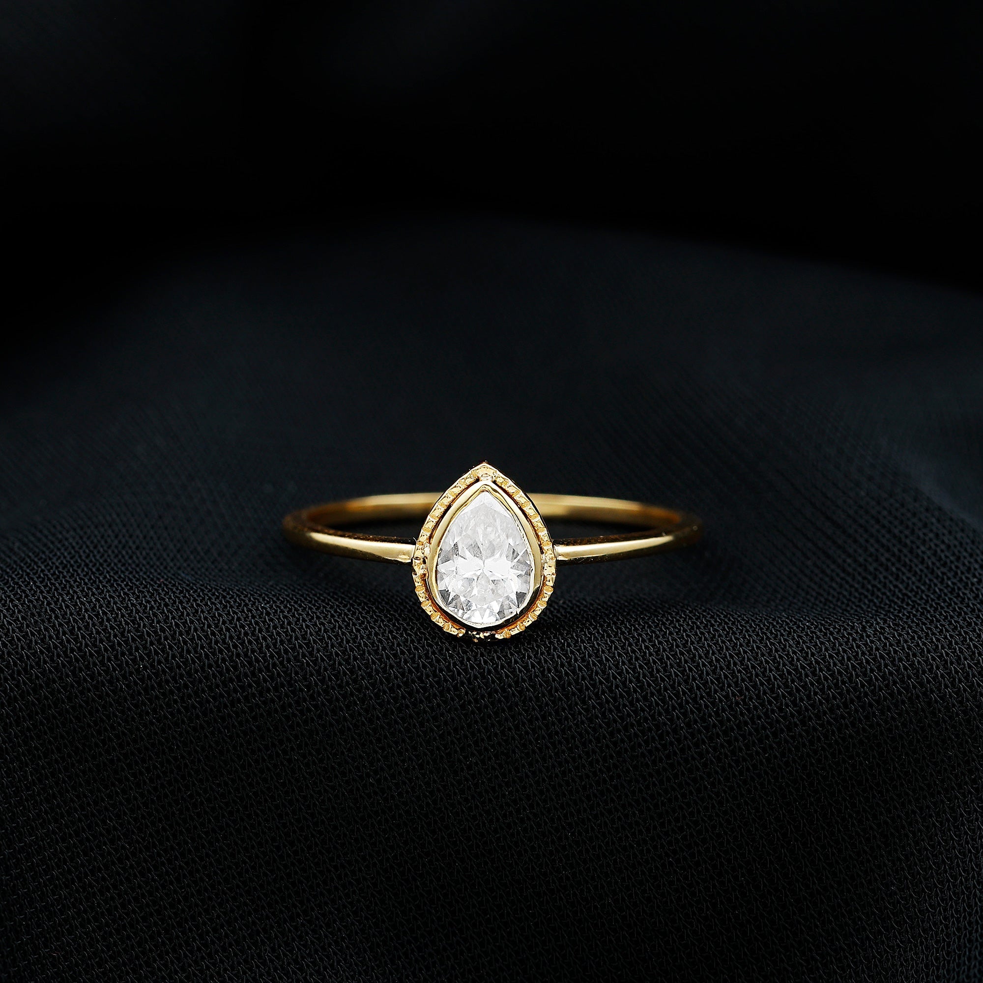 Pear Shaped Moissanite Solitaire Engagement Ring in Bezel Setting