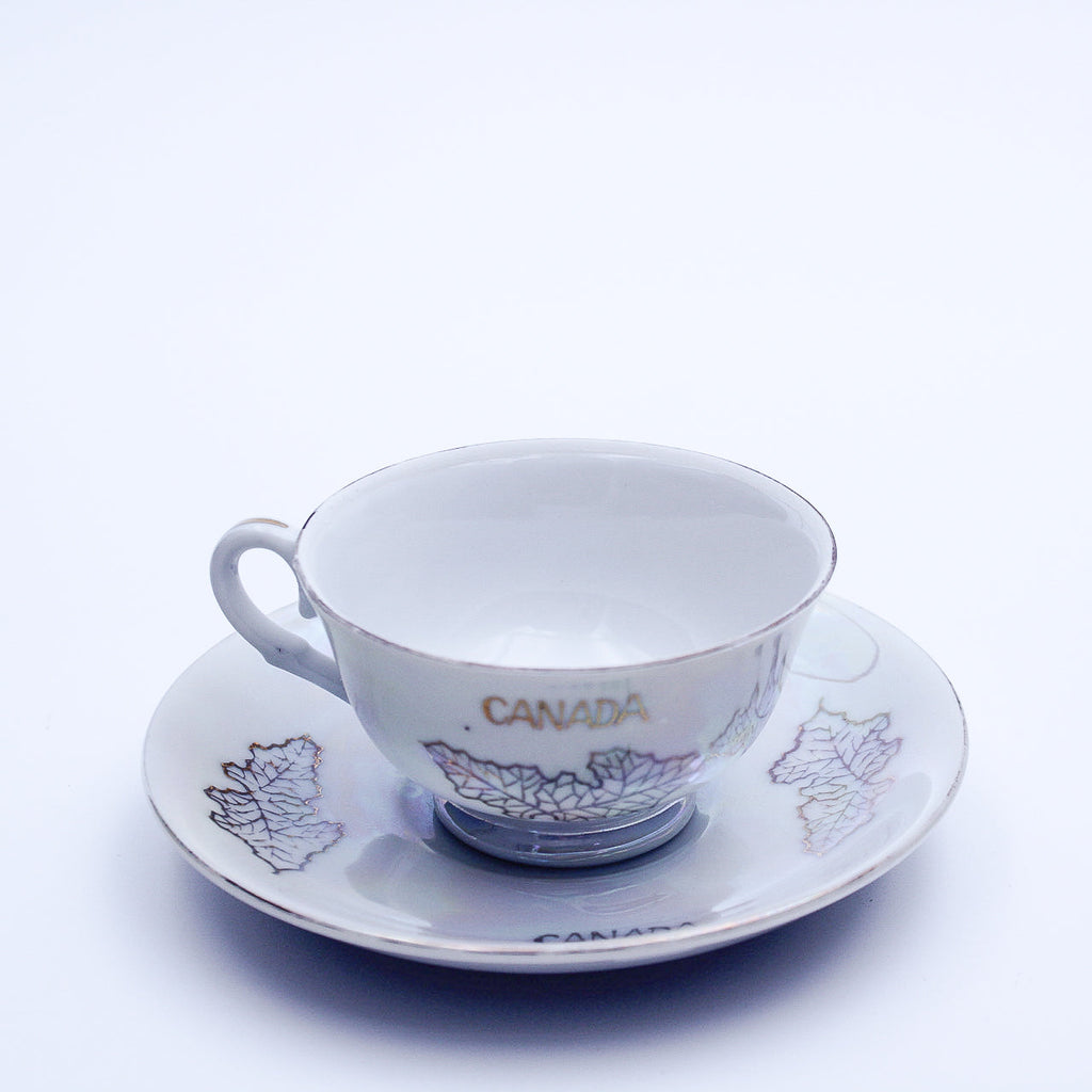Iridescent Niagara Falls Teacup and Saucer — Gold Maple Leaves