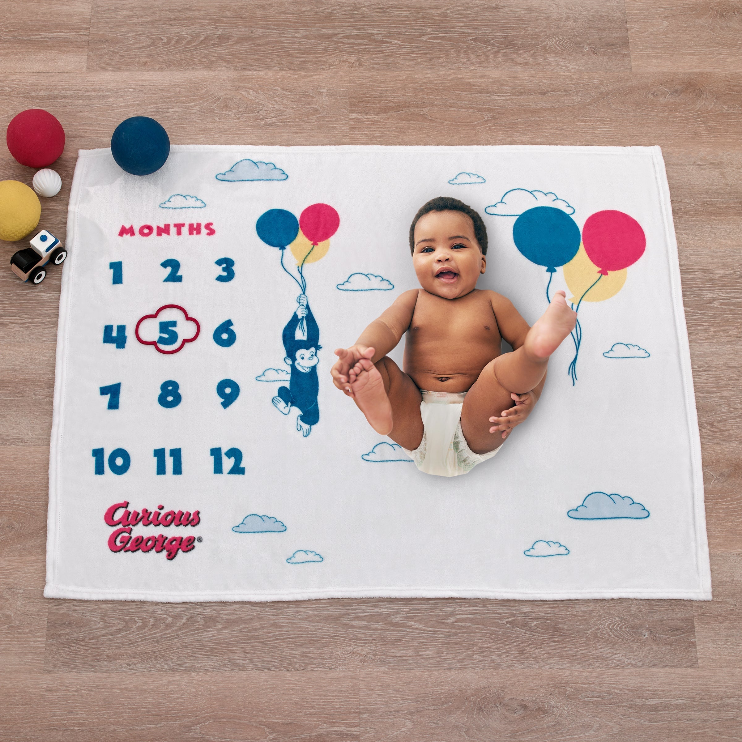 Curious George White, Blue, Red, and Yellow Balloons and Clouds Super Soft Milestone Baby Blanket