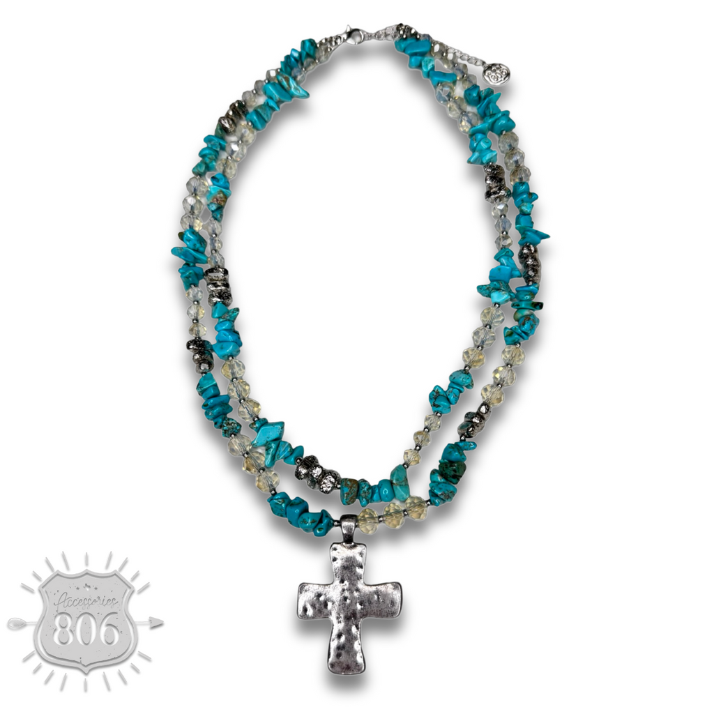 Textured cross pendant on chip stone double strand necklace