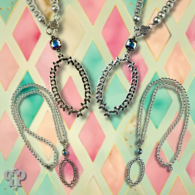 Long pearl bead necklace with shiny metal pendant with crystals from Swarovski®
