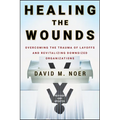 Healing the Wounds: Overcoming the Trauma of Layoffs and Revitalizing Downsized Organizations - Hardcover